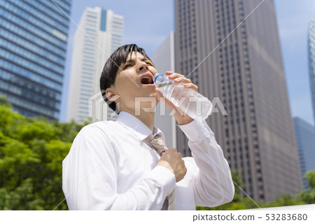 Hot summer businessman image hydration 53283680