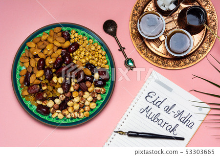 Eid Mubarak note with snacks and coffee 53303665