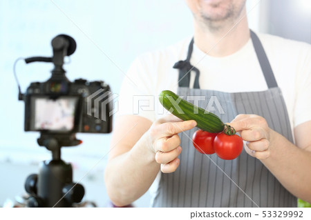 Chef Vlogger Holding Tomatoes Cucumber Humorously 53329992