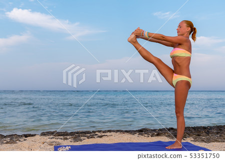 Woman doing yoga 53351750