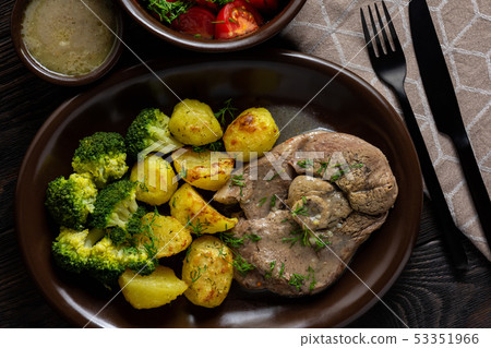 Slow roast leg of lamb with roasted potatoes. 53351966