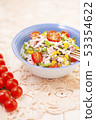 Rice salad with pork steak, tomatoes, corn seeds and tomatoes. 53354622