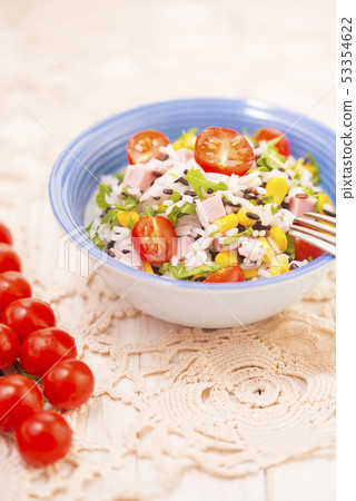 Rice salad with pork steak, tomatoes, corn seeds and tomatoes. Rice salad with pork steak, tomatoes, corn seeds and tomatoes. 53354622