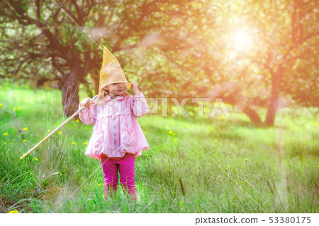 Little girl dressed net for catching butterflies on his head Little girl dressed net for catching butterflies on his head 53380175