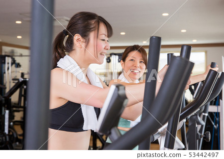 Women walking in the gym Women walking in the gym 53442497