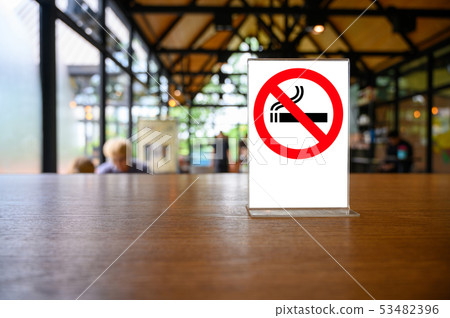 no smoking sign with shopping place background on no smoking sign with shopping place background on 53482396