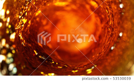 Detail of cola, tea or hard spirit beverages whirl 53530039