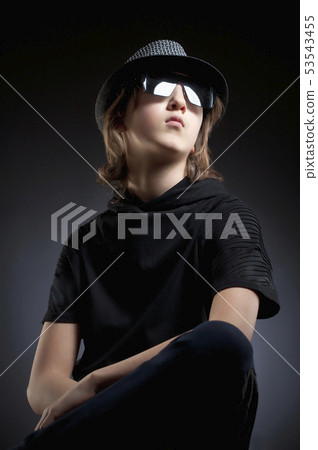 Portrait of a Boy with Blond Hair in Hat and Black Portrait of a Boy with Blond Hair in Hat and Black 53543455