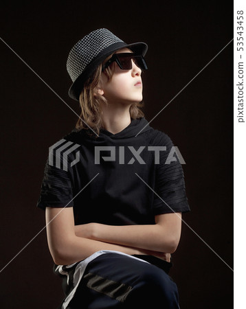 Portrait of a Boy with Blond Hair in Hat and Black Portrait of a Boy with Blond Hair in Hat and Black 53543458