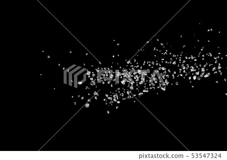 Split debris of stone exploding against black 53547324