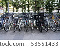 Bicycles parked full of bicycle storage 53551433