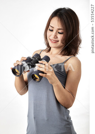 Young Asian woman with binoculars Young Asian woman with binoculars 53554227