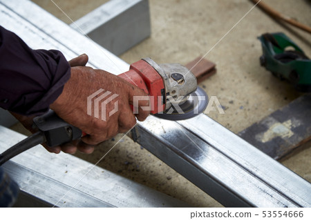 Hand Electric wheel grinding on steel 53554666