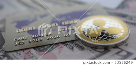 Silver coin ripple XRP closeup lie on table Silver coin ripple XRP closeup lie on table 53556249