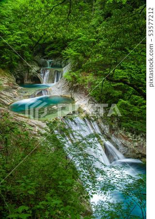 Fresh green nishizawa valley seven waterfalls five steps waterfall 53577212
