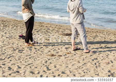 A woman looking at the sea 53591037