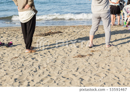 Women watching children 53591467