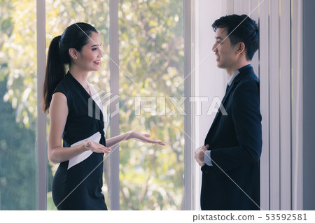 Asian business people talking together in Asian business people talking together in 53592581