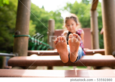 Girls playing barefoot Girls playing barefoot 53592860