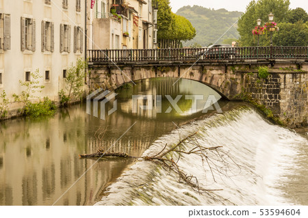 Arcades of the old bridge over the river Salat 53594604