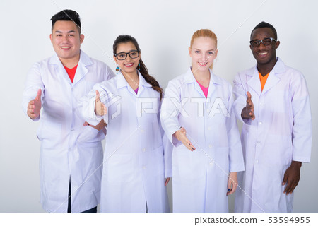 Studio shot of happy diverse group of multi ethnic doctors smili 53594955