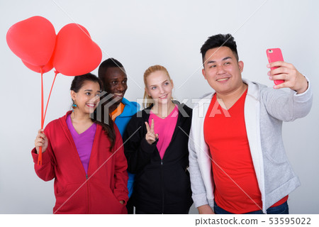 Studio shot of happy diverse group of multi ethnic friends smili Studio shot of happy diverse group of multi ethnic friends smili 53595022