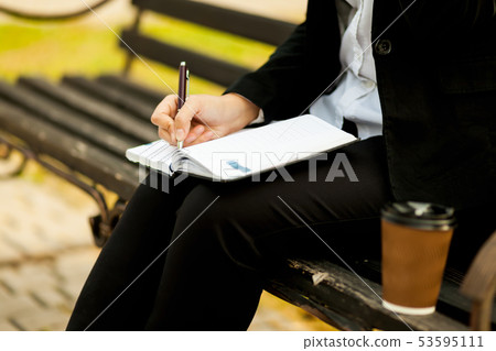 Happy businesswoman calling on mobile phone and Happy businesswoman calling on mobile phone and 53595111