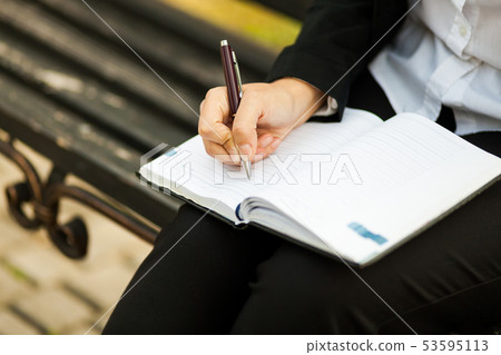Happy businesswoman calling on mobile phone and Happy businesswoman calling on mobile phone and 53595113