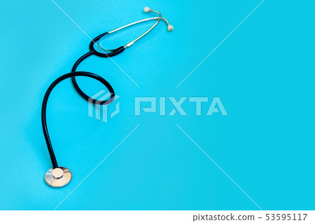 Black stethoscope on blue background 53595117