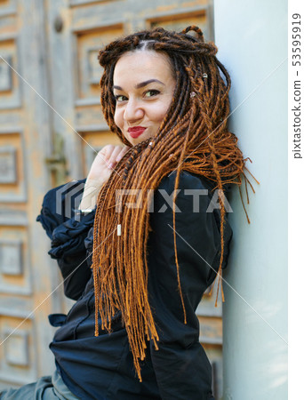 dreadlocks fashionable girl posing at old wooden dreadlocks fashionable girl posing at old wooden 53595919