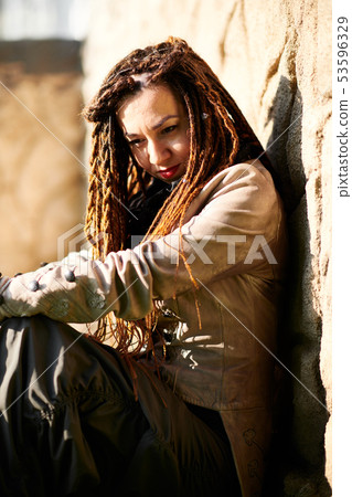 dreadlocks fashionable girl posing in very bright dreadlocks fashionable girl posing in very bright 53596329