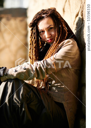 dreadlocks fashionable girl posing in very bright dreadlocks fashionable girl posing in very bright 53596330