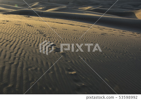 Beautiful sand dunes and sunrise in the village of Jaisalmer Coulee in Rajasthan, India Beautiful sand dunes and sunrise in the village of Jaisalmer Coulee in Rajasthan, India 53598992