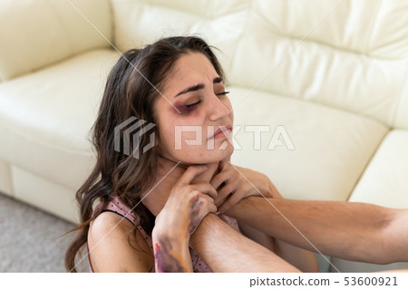 Victim, abuse and domestic violence - Woman being abused and strangled by strong man Victim, abuse and domestic violence - Woman being abused and strangled by strong man 53600921