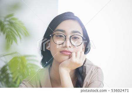 Young woman with a cane 53602471