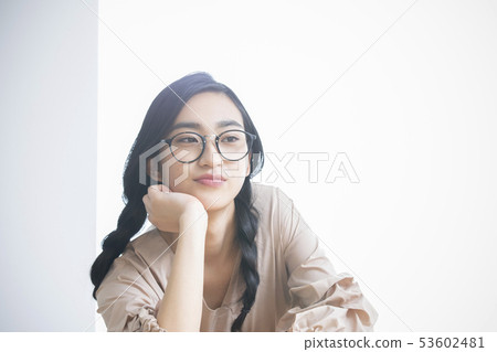 Young woman with a cane 53602481