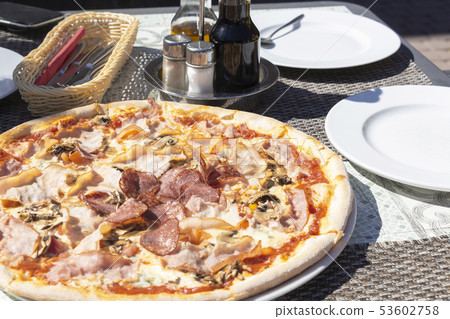 pizza with pepperoni, salami, pepper, cheese, 53602758