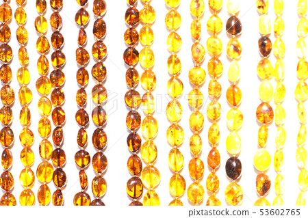 beads with amber, bright colorful pieces of amber. 53602765
