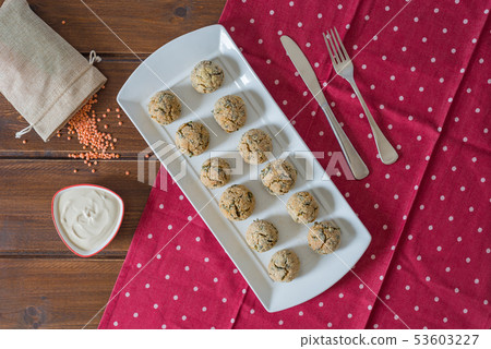 Baked falafel balls on a wooden table Baked falafel balls on a wooden table 53603227