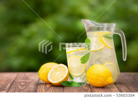 lemonade in glass and jug 53603384