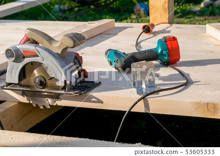 circular saw on a wooden Board 53605333