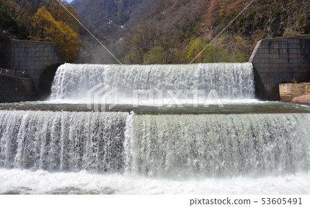 Sabo dam flowing through a large amount of snowmelt 53605491