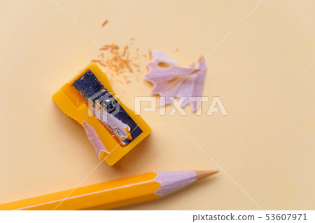 Yellow pencil and metal sharpener on workplace 53607971