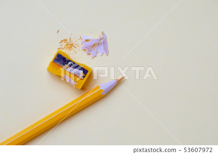 Yellow pencil and metal sharpener on workplace 53607972