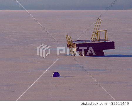 Tower of sliding track in frozen lake, icy water 53611449