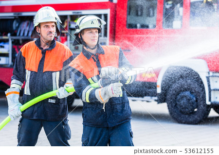 men of the fire department extinguish fire  53612155