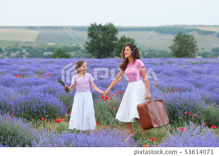 young woman and girl are walking through the young woman and girl are walking through the 53614071