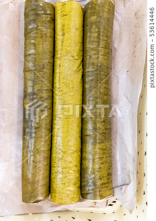 Thee rolls of lemang, glutinous rice cooked in 53614446