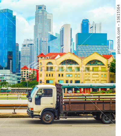 Truck on highway, Singapore cityscape 53615564