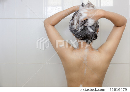 Young asian woman taking a shower and washing hair 53616479